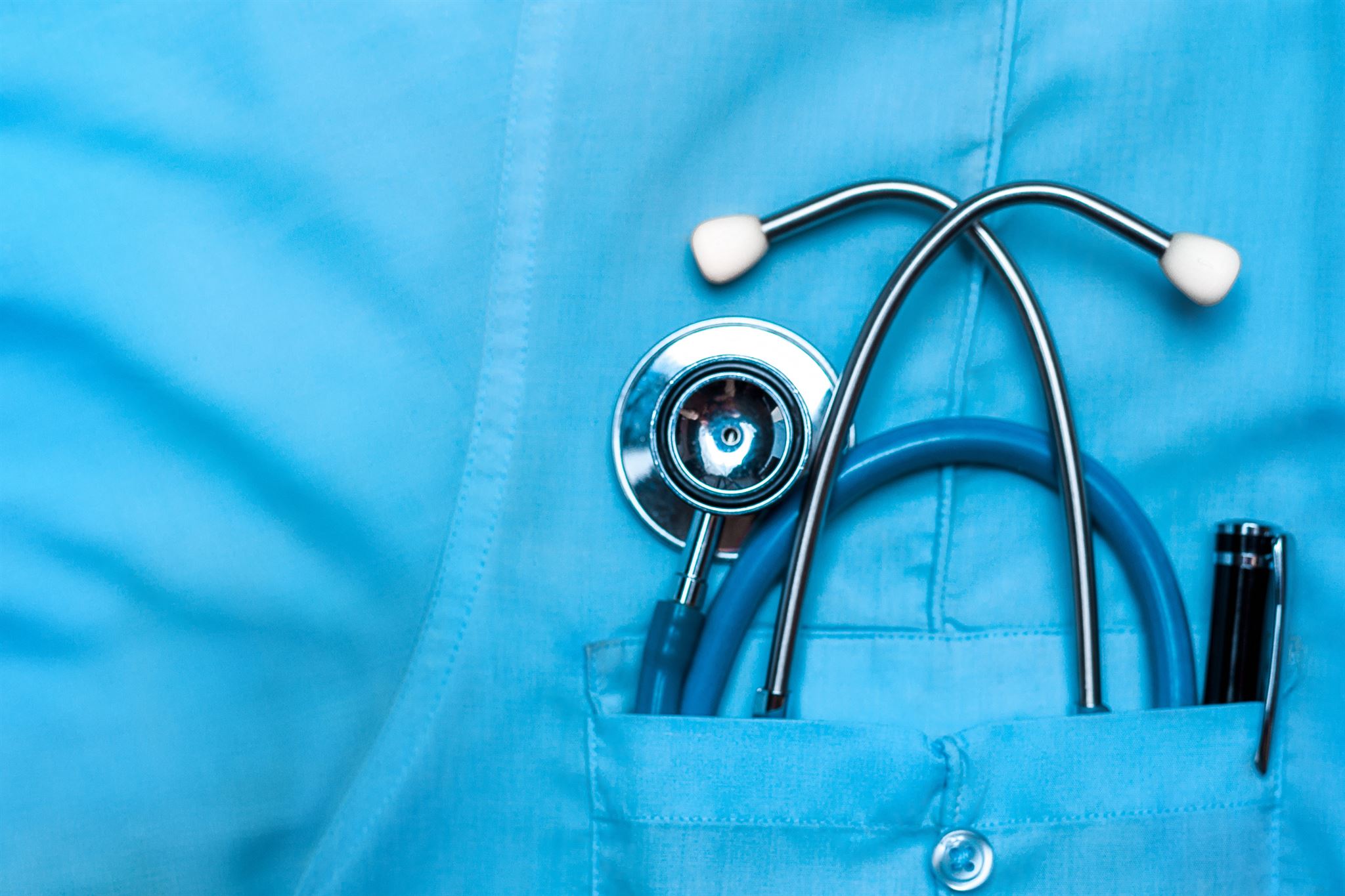 Close-up-of-stethoscope-in-scrubs-pocket